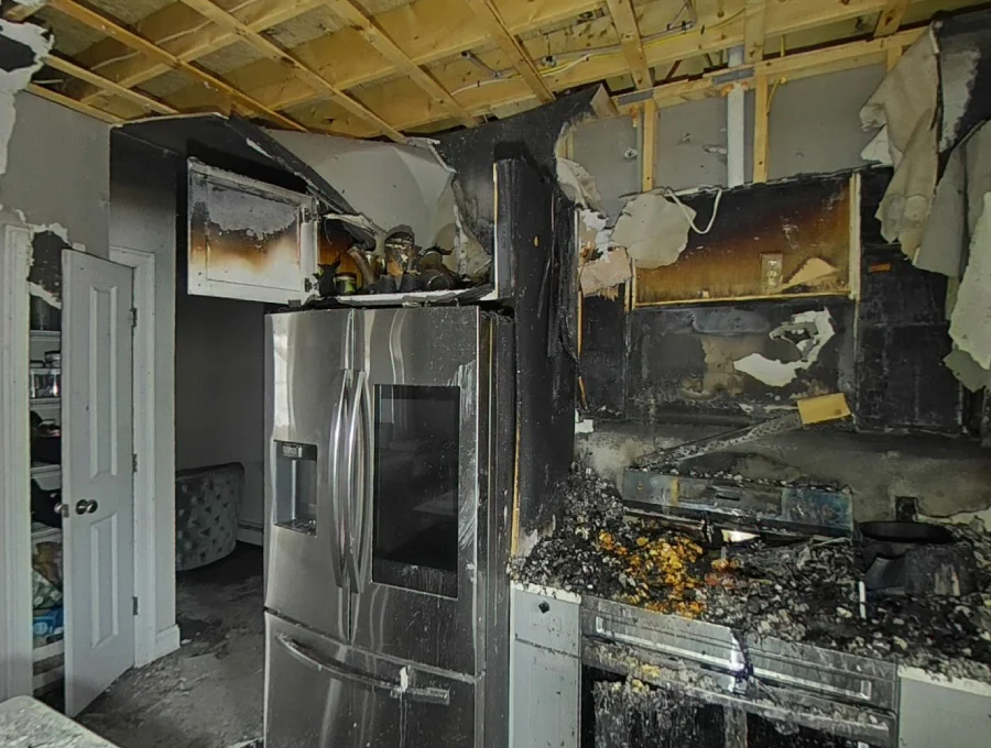 Fire-damaged kitchen before reconstruction in Westbrook home.